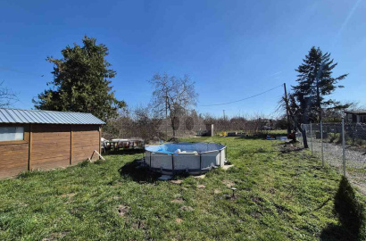 Garden with a wooden cottage in a new guard for sale